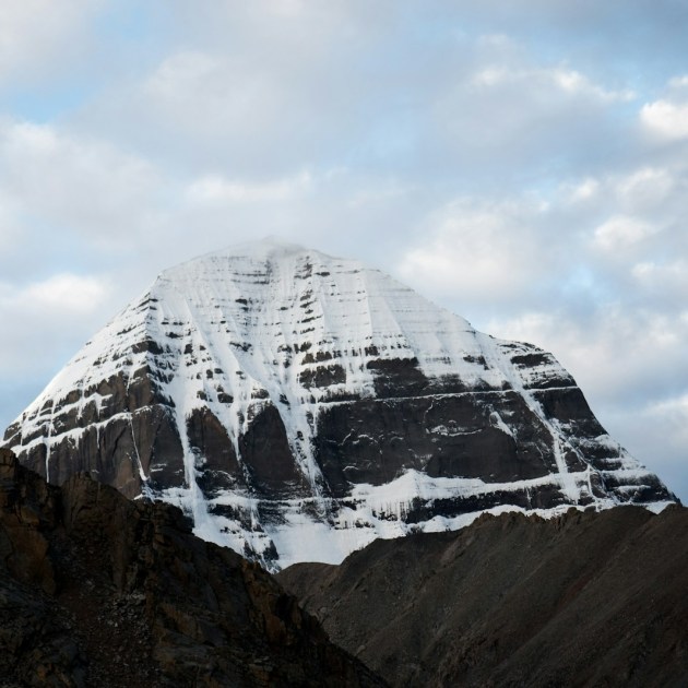 snow covered mountain under cloudy sky during daytime