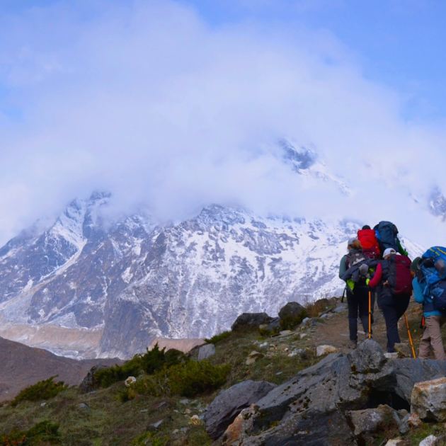 A group of people hiking up a mountain